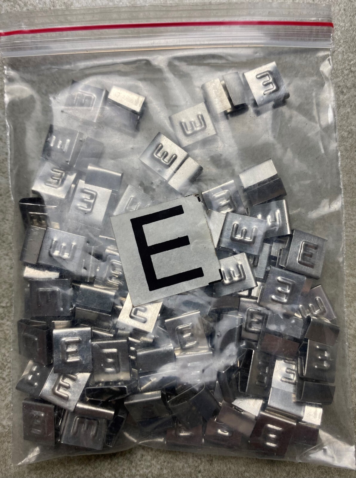 HAYATA ID-E, Stainless Steel Cable Marker 316SS, Symbol “E” , 100 Pc’s Pkt