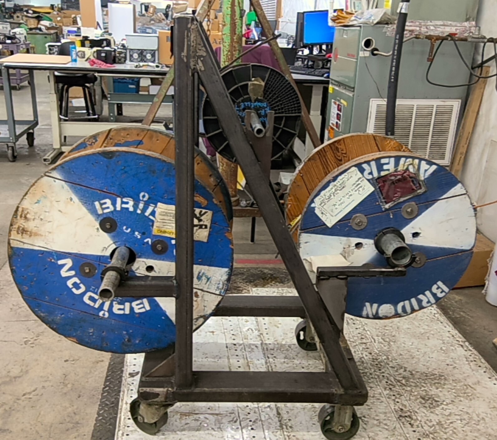 Portable Wire Rack Dispenser With 3 Rolls of wire as pictured