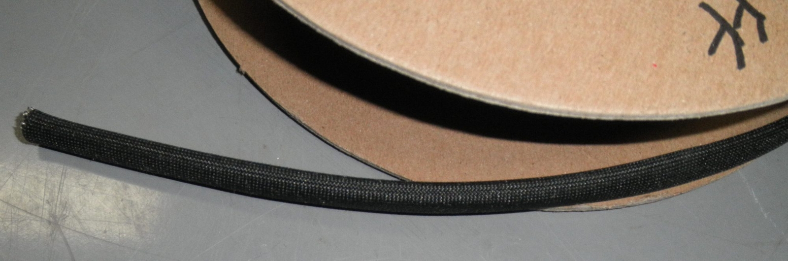 One Foot 1/4″ High Temp Fiberglass Wire Sleeve 1200F 2 AWG 650C