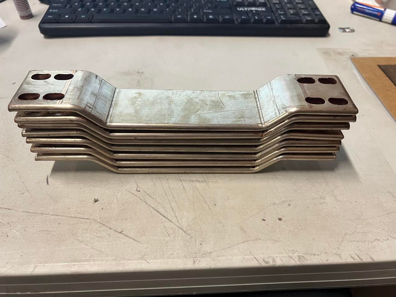 lot of 7 10″ busbar already bent and punched 4 oval holes each side see pictures